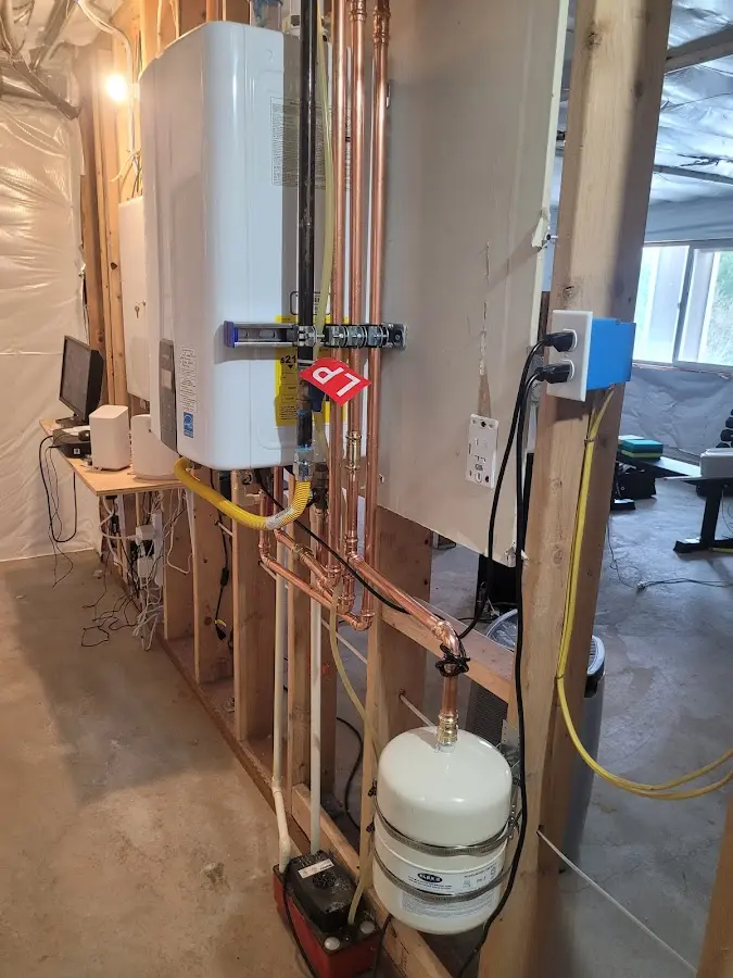 Licensed plumber repairing a kitchen sink in Muskego