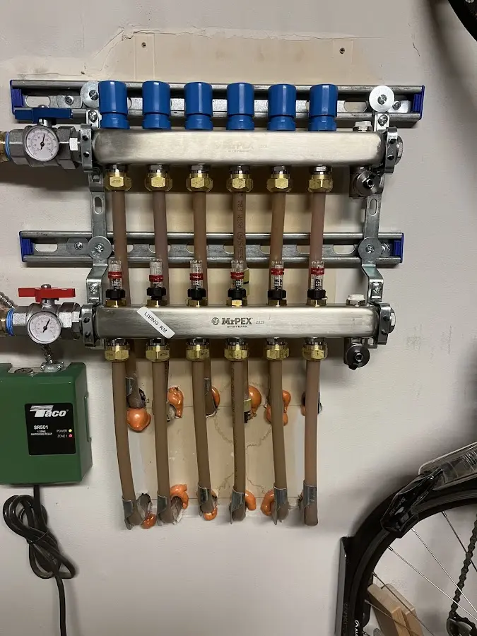 Plumber performing Water Heater Repair at a residential property in Muskego